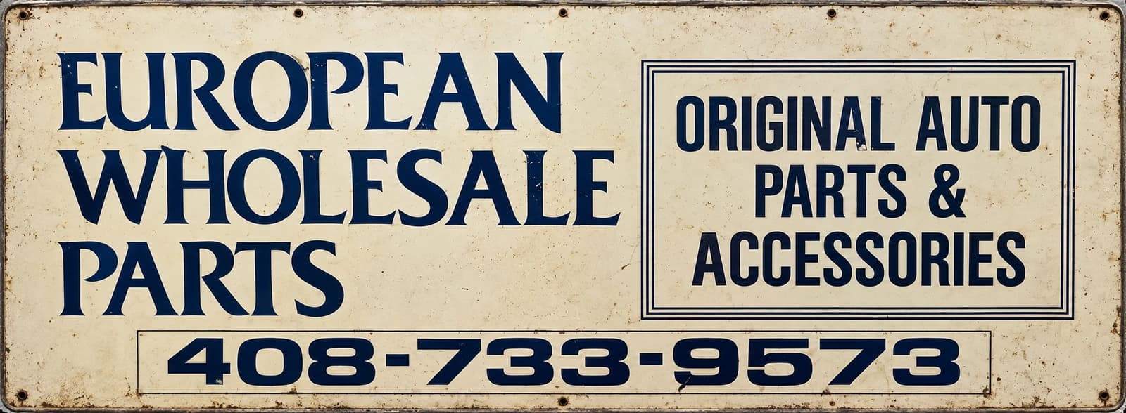 Restored European Wholesale Parts sign from the original Sunnyvale shop, showing European auto parts and accessories and the historic telephone number.